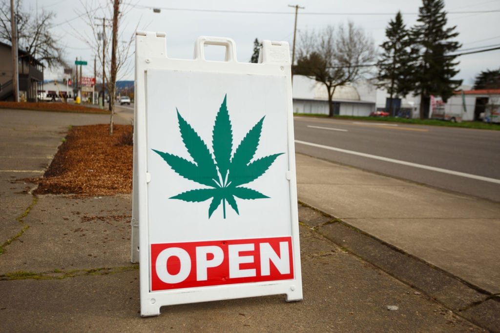 open sign with cbd plant